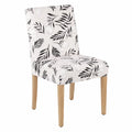 Sedia da pranzo in tessuto floreale bianco e nero con gambe in legno